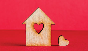 wooden house with heart cutout